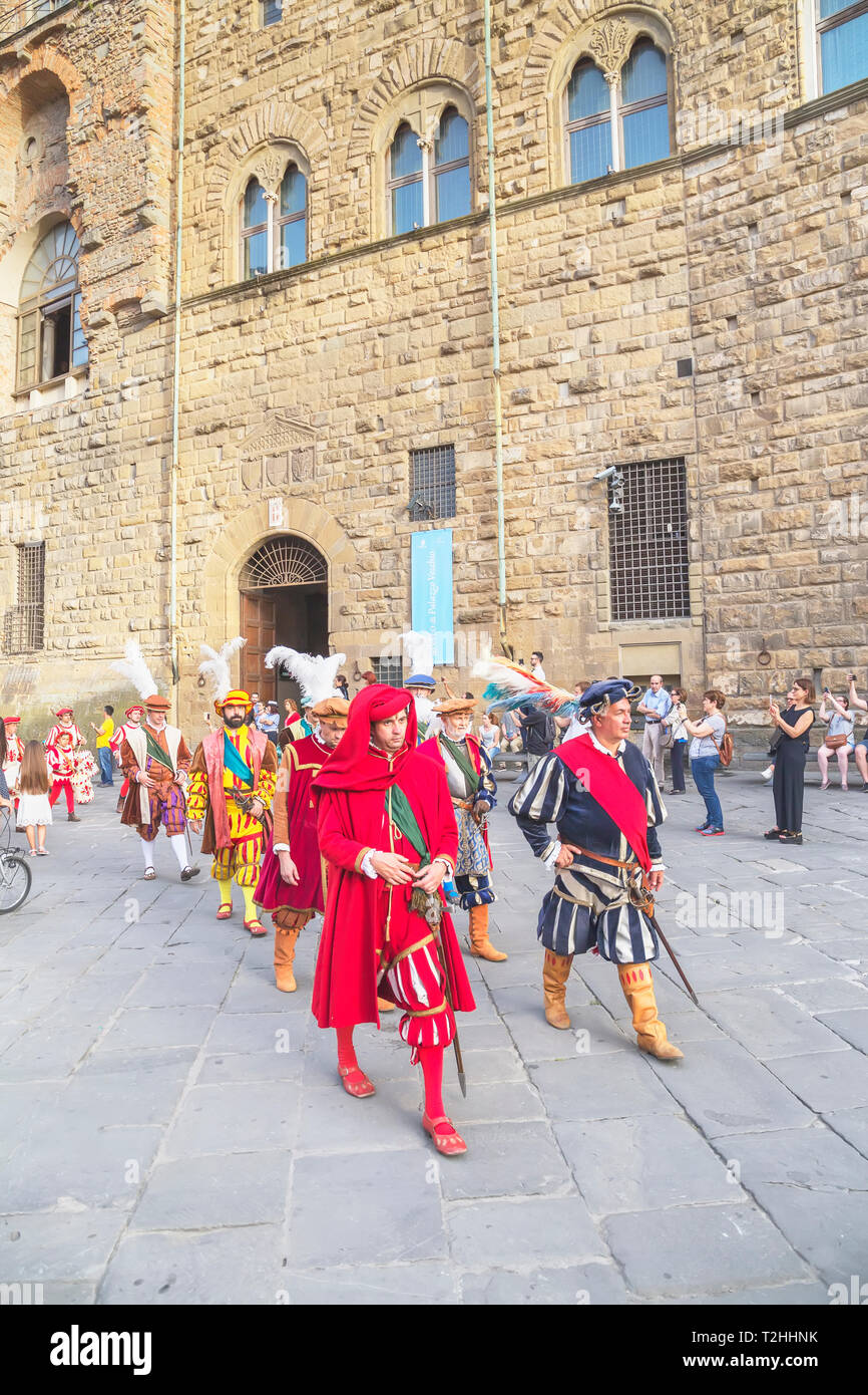 Men marching in costume during Calcio Storico Fiorentino festival at Piazza della Signoria in Florence, Tuscany, Italy, Europe Stock Photo