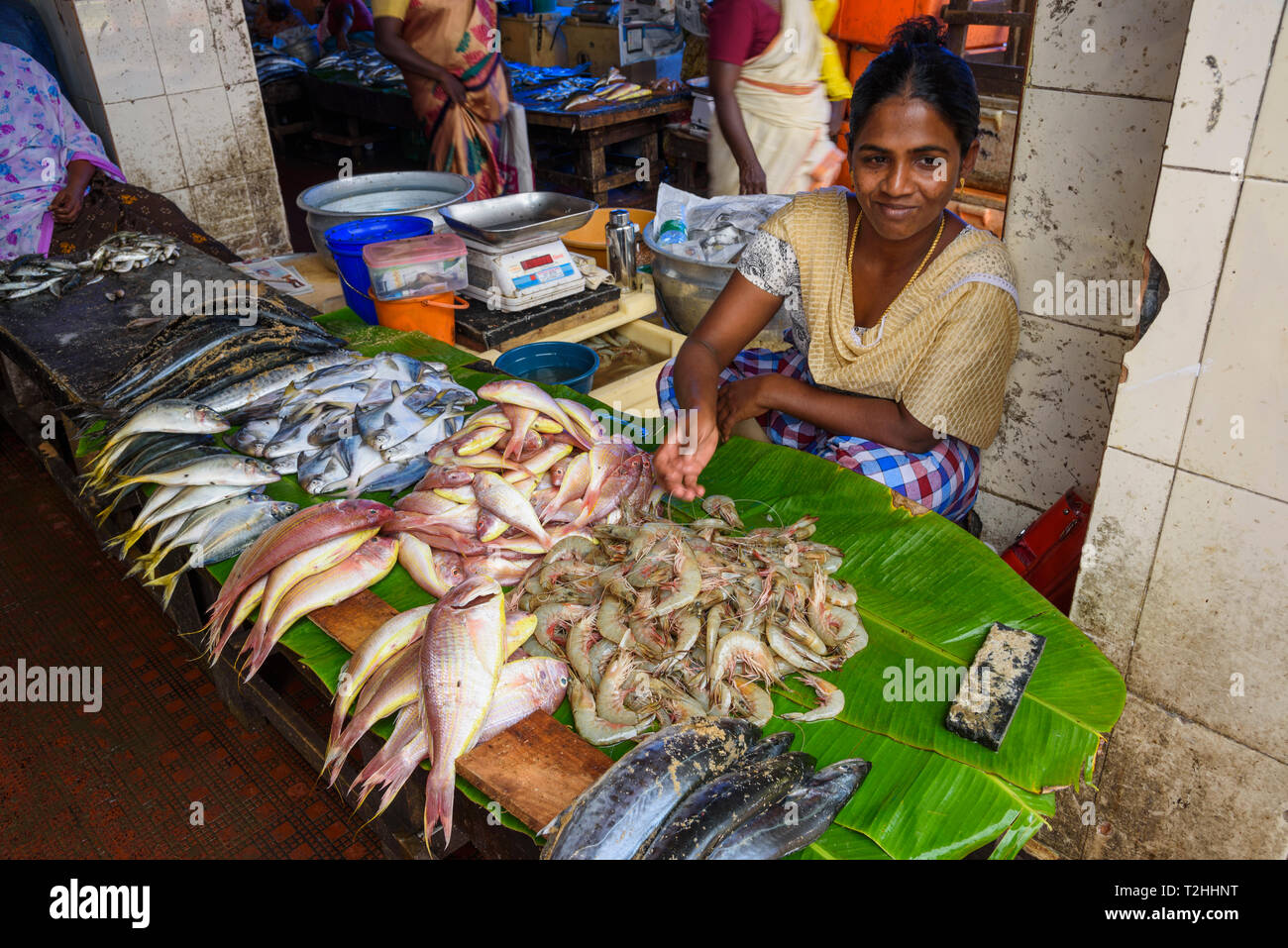 Woman selling fresh seafood at street market in Trivandrum, India Stock Photo