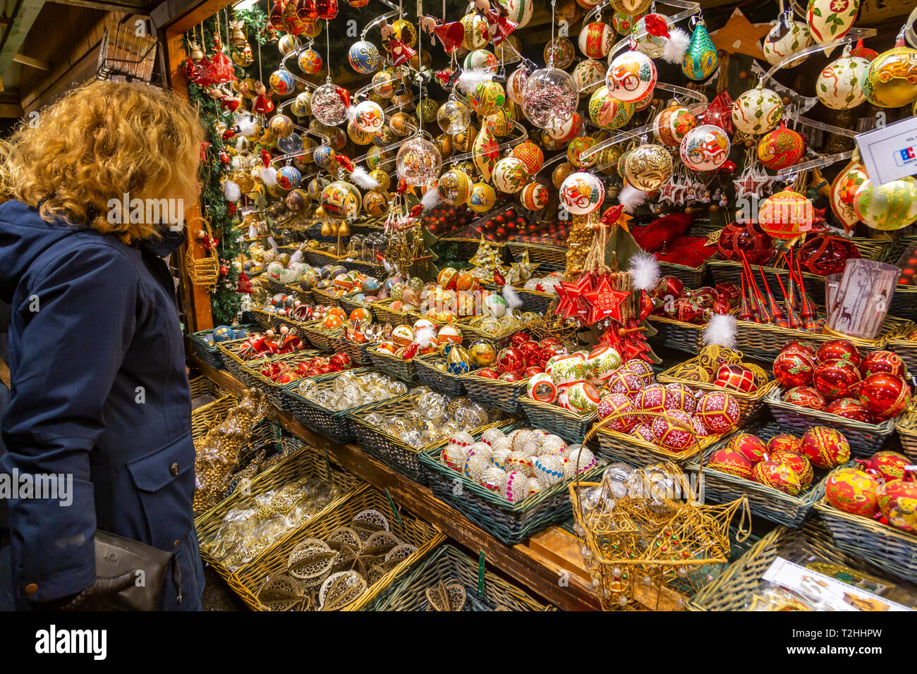 Woman shopping for Christmas decorations at market in Rathausplatz, Vienna, Austria, Europe Stock Photo