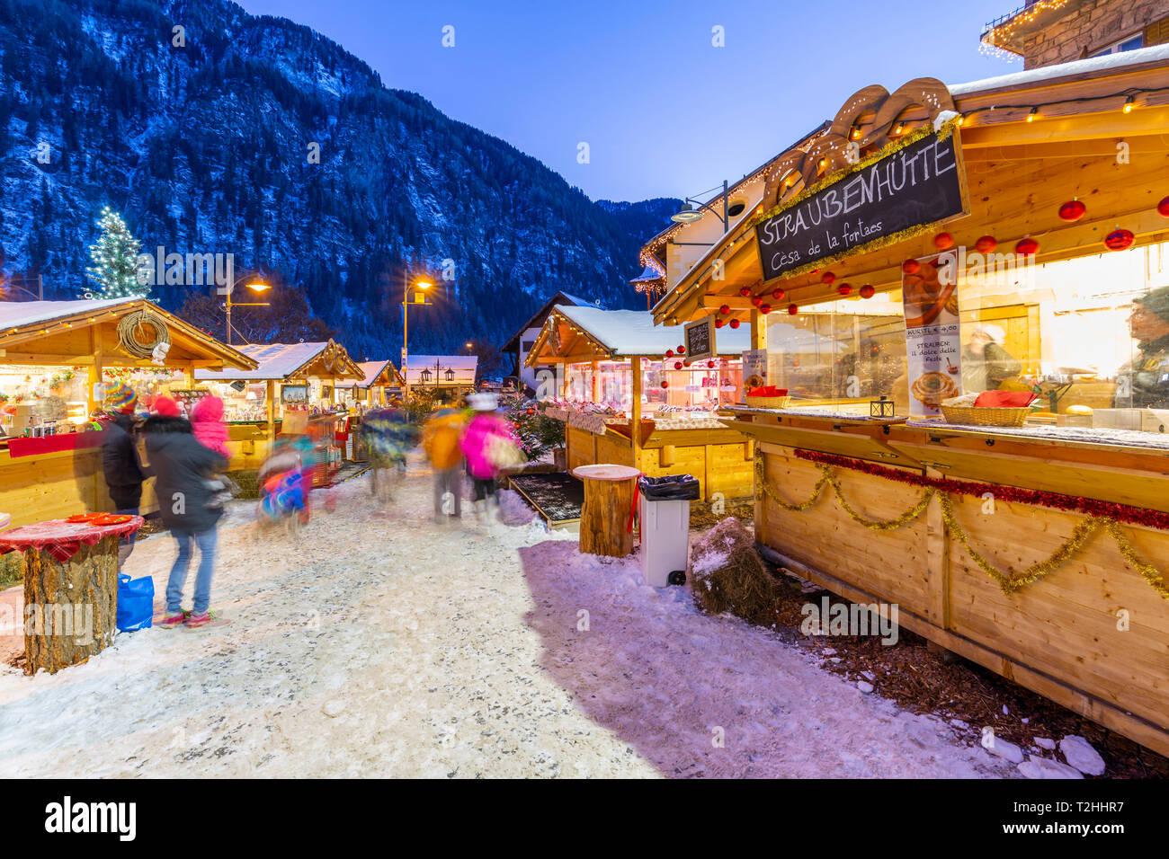 Christmas market at sunset in Campitello di Fassa, Val di Fassa, Trentino, Italy, Europe Stock Photo