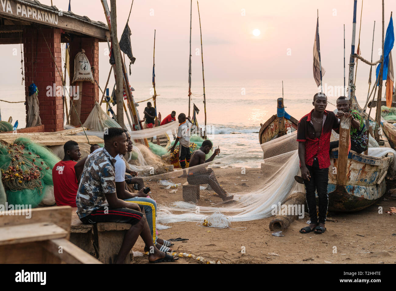 Fishermen fixing nets in Cape Coast, Ghana, Africa Stock Photo
