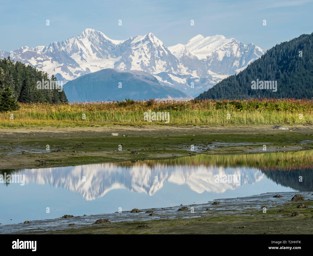 The Fairweather Range reflected in calm water, Fern Harbour, Glacier Bay National Park, Alaska, United States of America Stock Photo