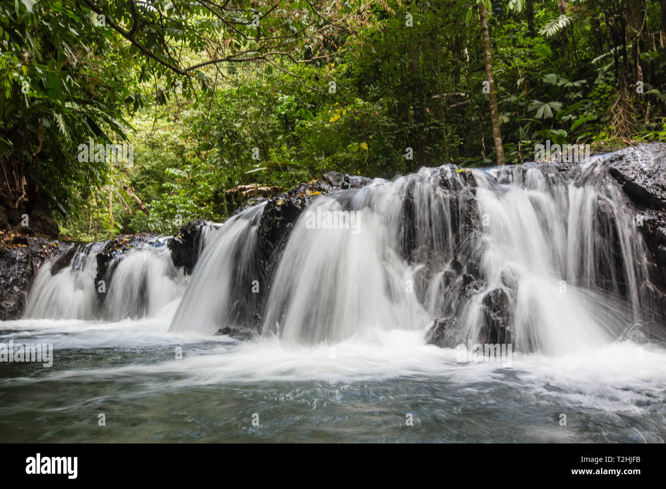 Slow motion blur of waterfall in Corcovado National Park, Osa Peninsula, Costa Rica, Central America Stock Photo