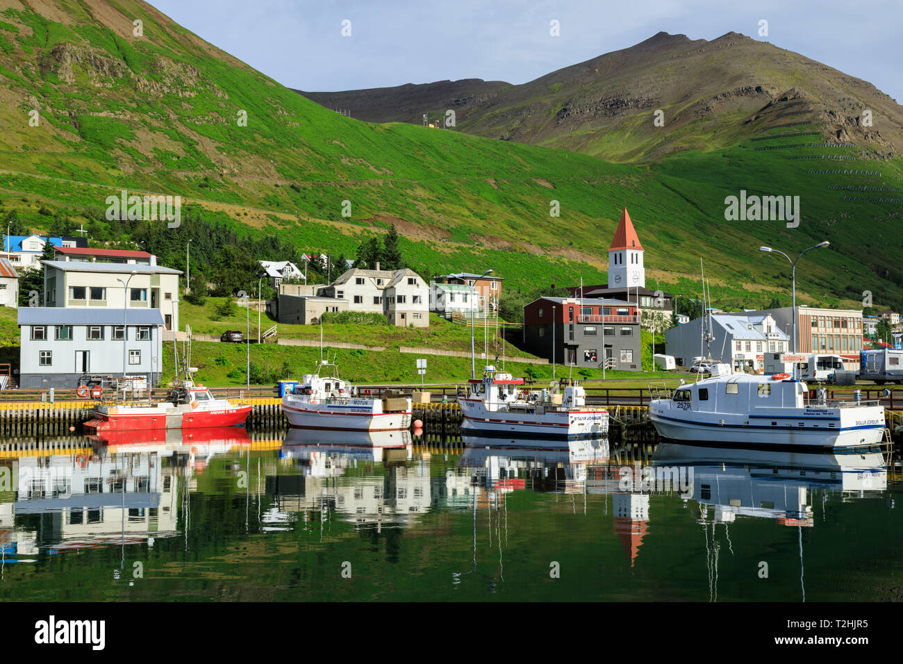 Town, mountains and fishing boats, Siglufjordur, (Siglufjorour), stunning Summer weather, North Iceland, Europe, Europe Stock Photo