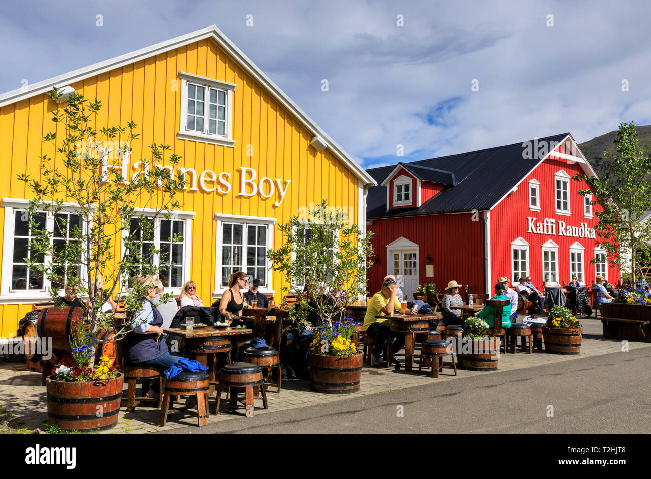 Busy, colourful cafes, Siglufjordur, (Siglufjorour), stunning Summer weather, northernmost town of the mainland, North Iceland, Europe Stock Photo