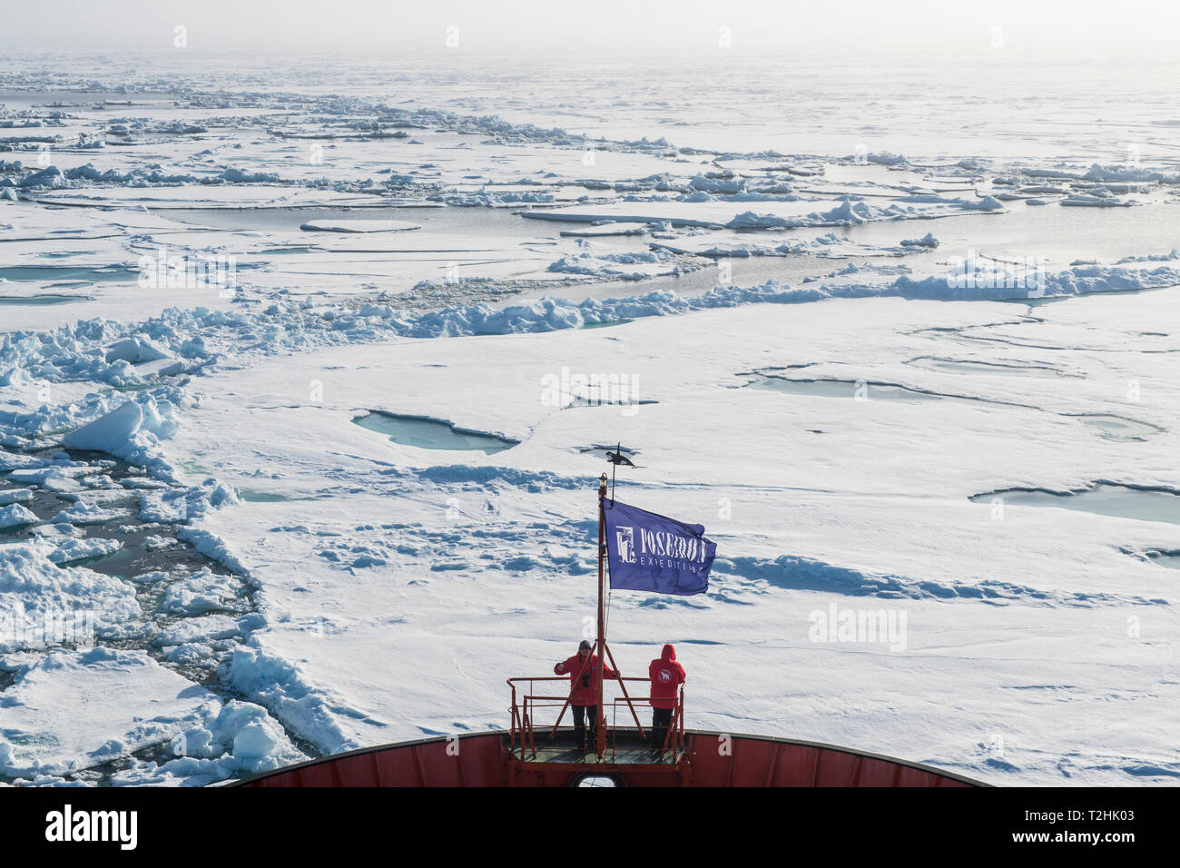 People enjoying the breaking ice on board of an icebreaker, North Pole, Arctic Stock Photo