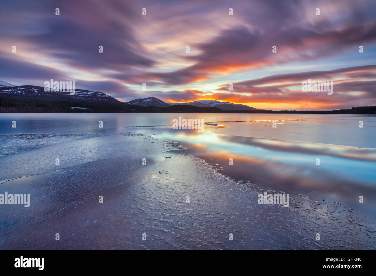 Ice sheets and sunset at Loch Morlich, Glenmore, Scotland, United Kingdom, Europe Stock Photo