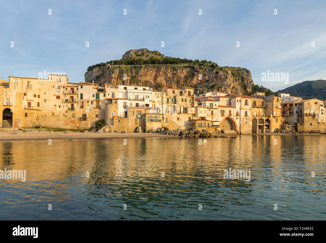 The old town of Cefalu with Rocca di Cefalu in the background, Cefalu, Sicily, Italy, Europe Stock Photo
