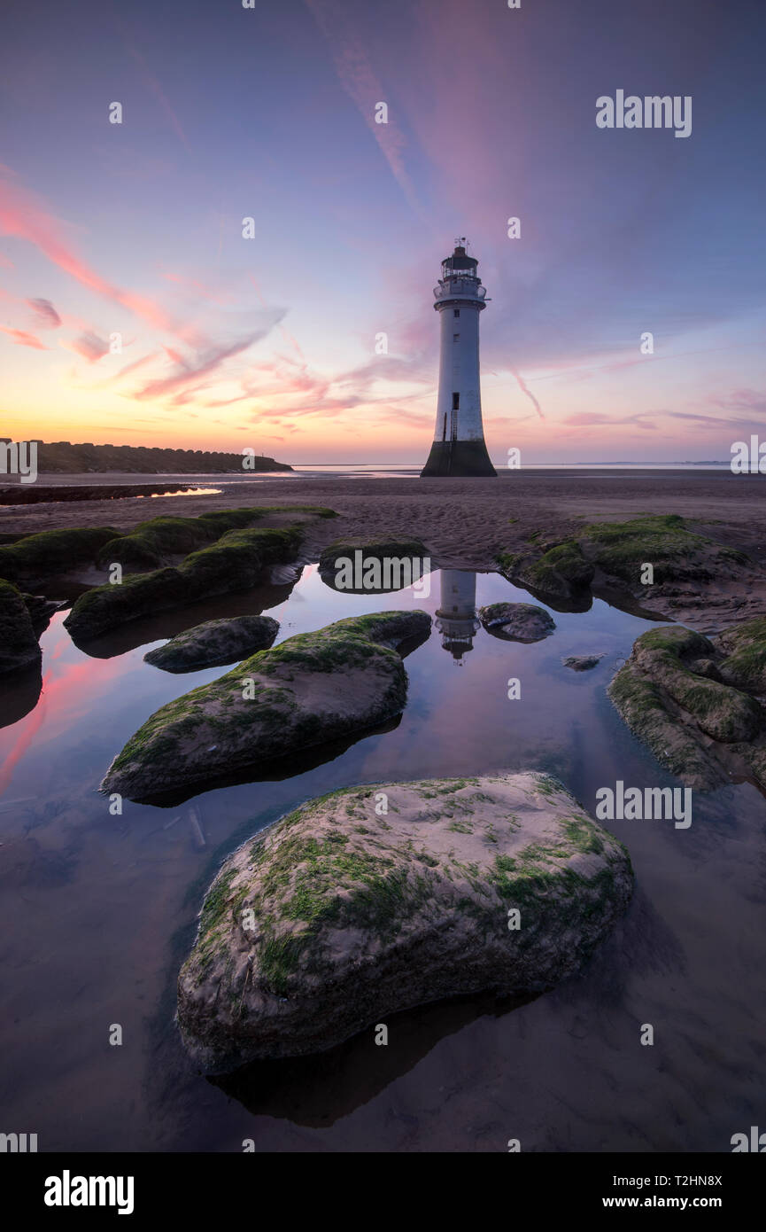 Perch Rock Lighthouse at New Brighton reflected with dramatic sunset, New Brighton, Cheshire, England, United Kingdom, Europe Stock Photo