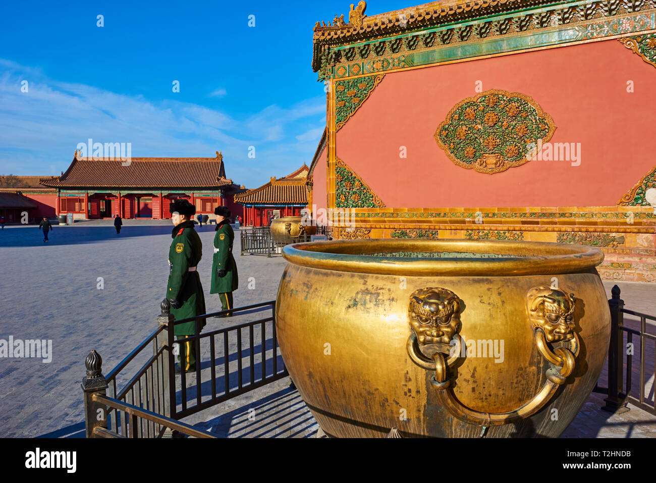 Golden cistern and security guards in the Forbidden City, Beijing, China Stock Photo