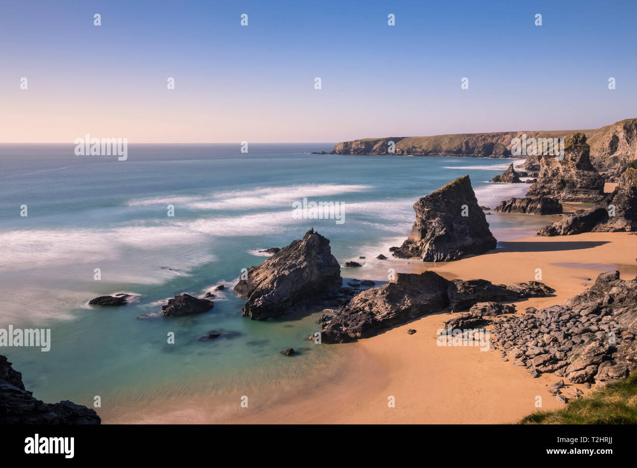 Dramatic cliffs and sea stacks at Bedruthan Steps and beach, on the north Atlantic coast of Cornwall, England, UK. March 2019. Stock Photo