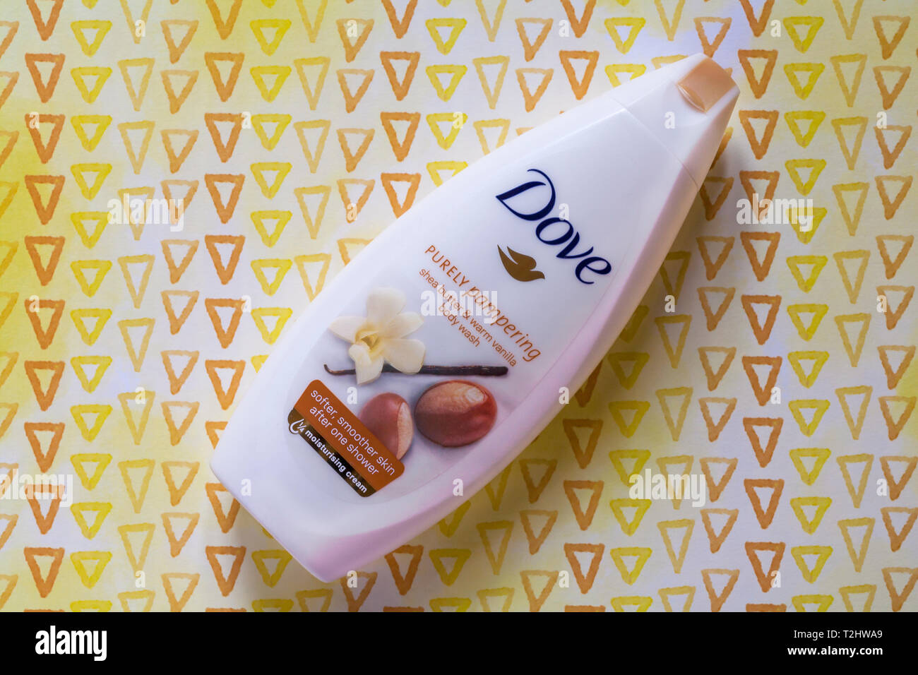 bottle of Dove purely pampering shea butter & warm vanilla body wash on patterned background Stock Photo