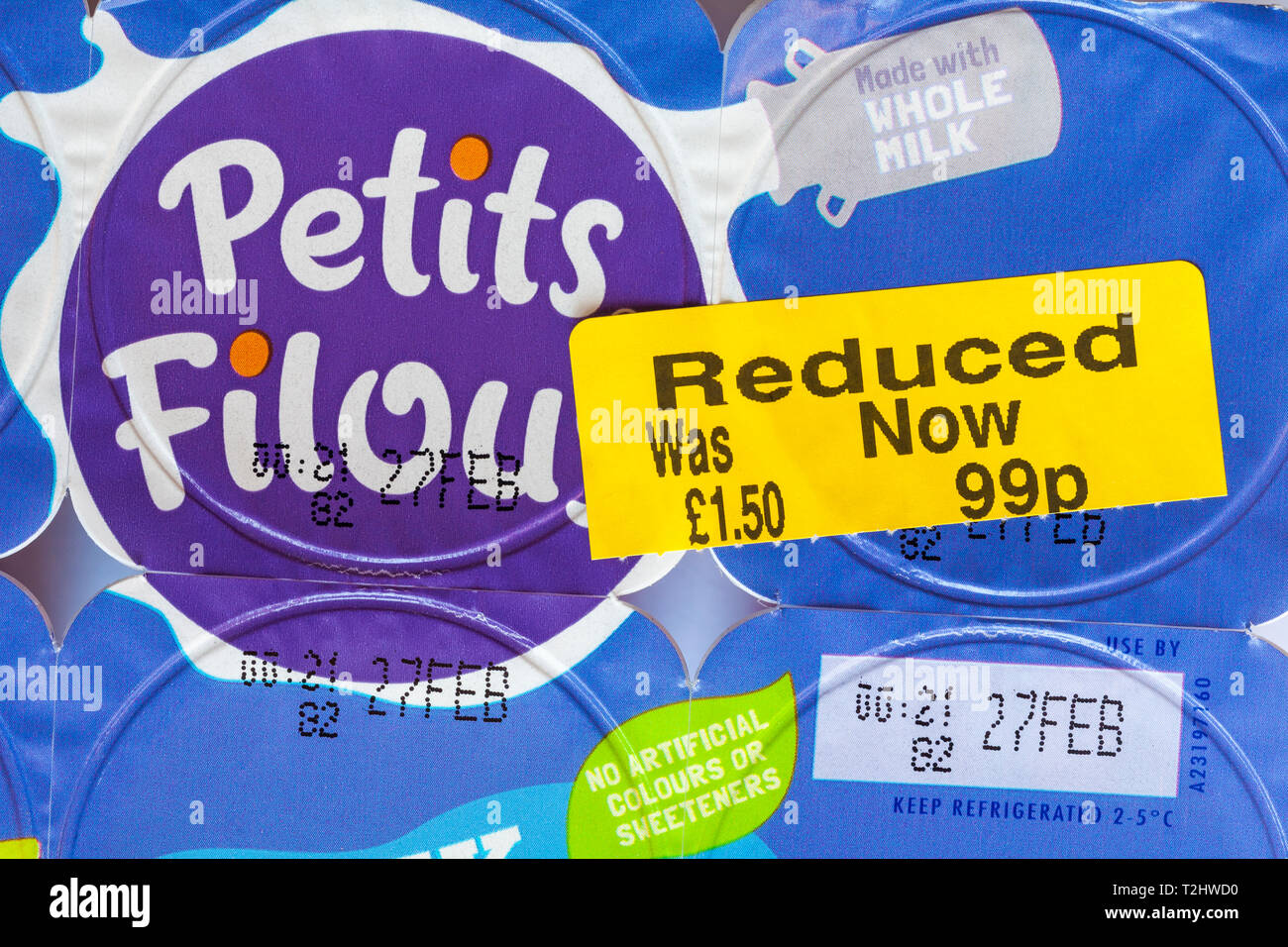 Yellow reduced sticker on multipack of Yoplait Petits Filous yogurts - no artificial colours or sweeteners - was £1.50 now 99p Stock Photo
