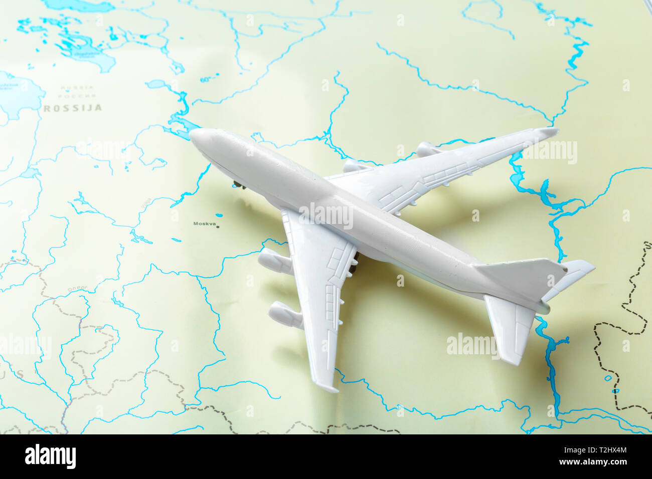 Model Aircraft Map miniature of a passenger aircraft flying on a map Stock Photo - Alamy