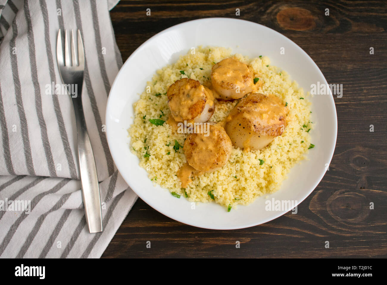 Scallops and Couscous with Curry Sauce Stock Photo Alamy