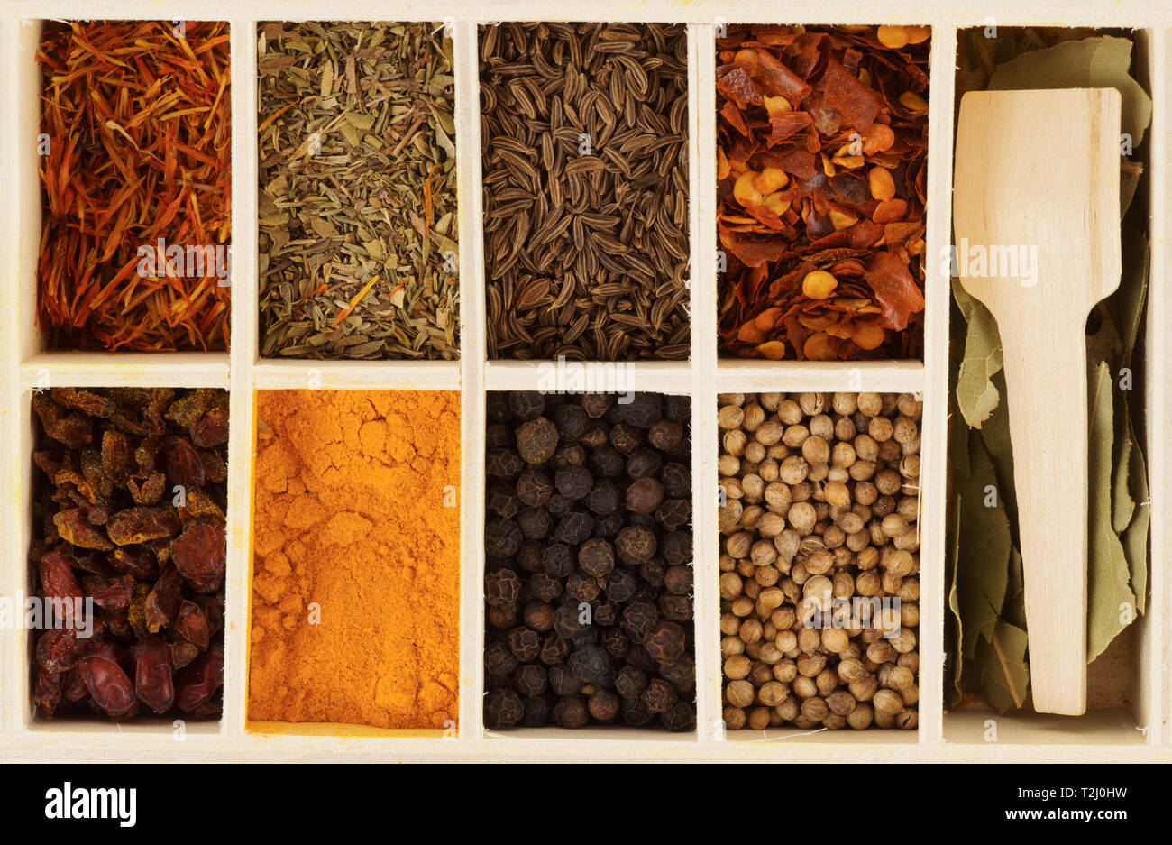 Set of spices for pilaf cooking in wooden box Stock Photo Alamy
