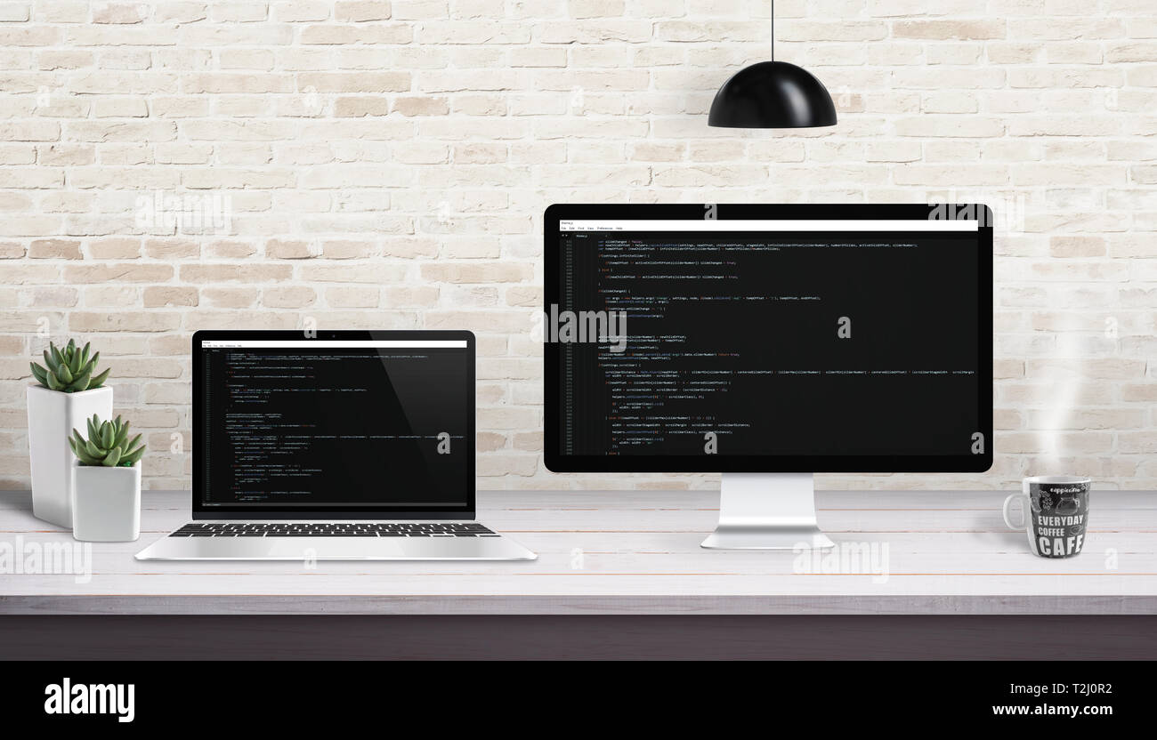 Web development on computer and laptop with concept of code editor on display. Stock Photo
