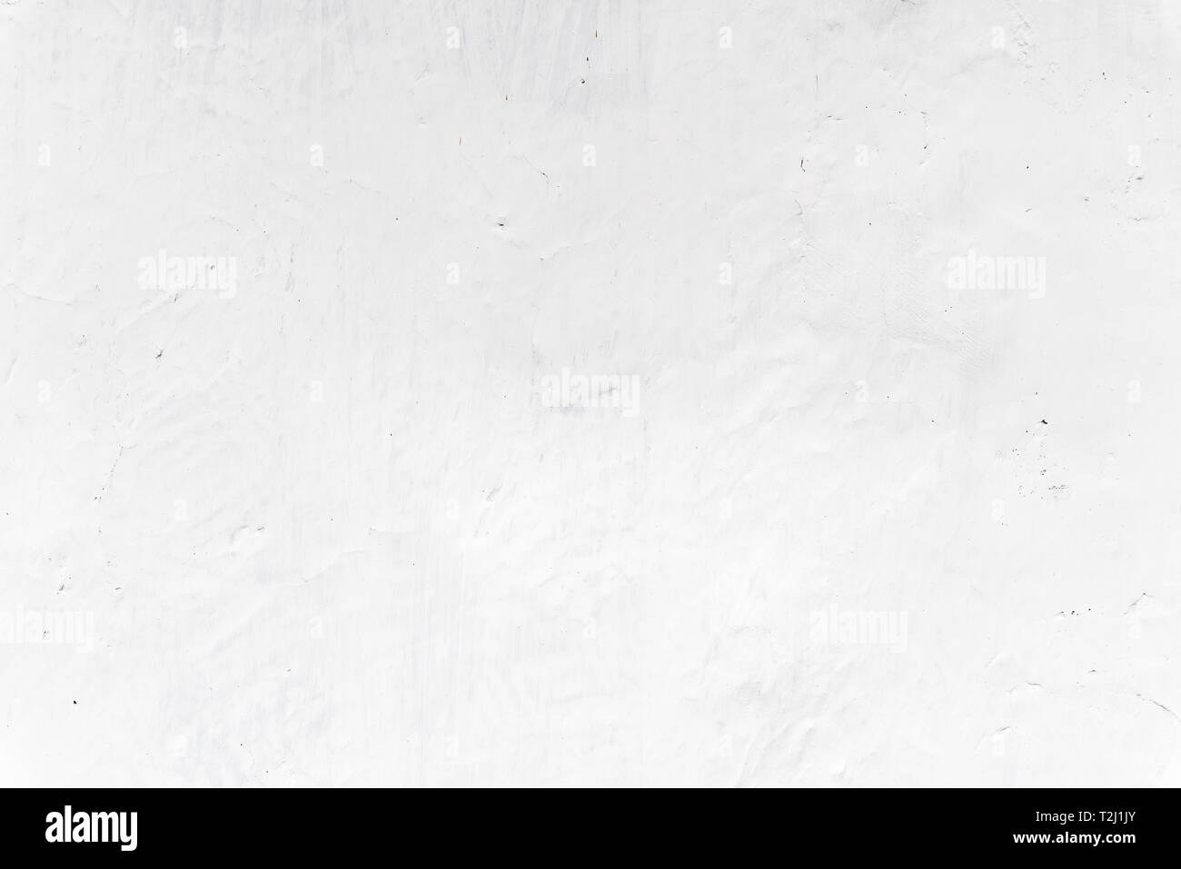 Adobe whitewashed wall in natural white color, traces of brush ...
