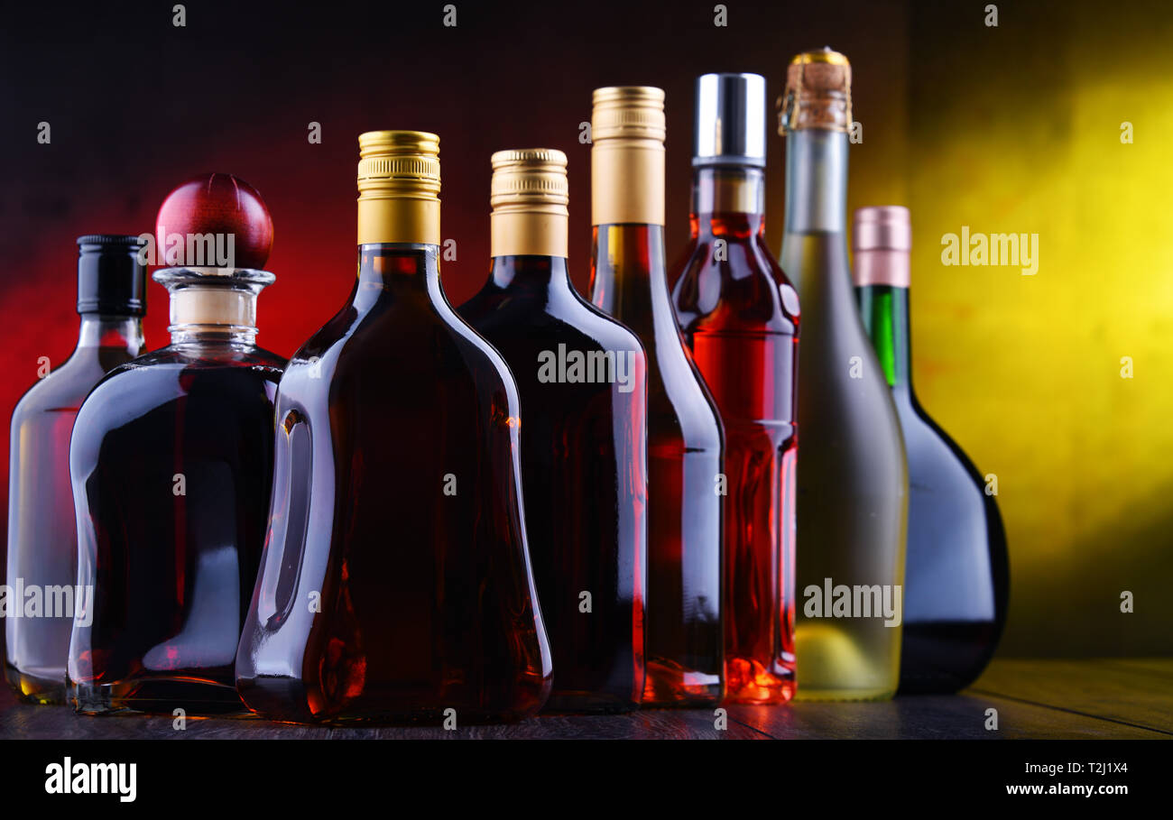 Composition with bottles of assorted alcoholic beverages. Stock Photo