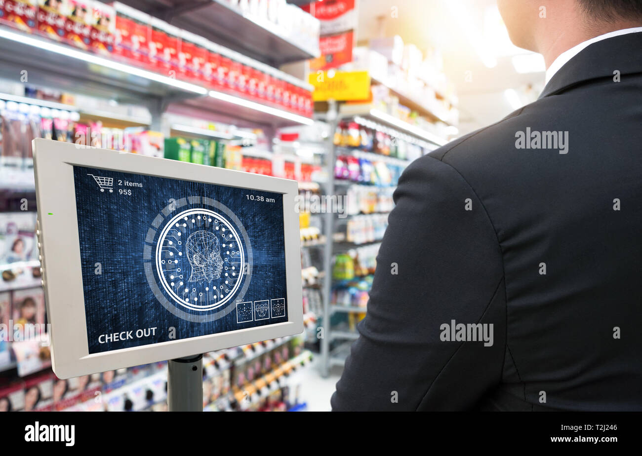 Machine learning systems technology , accurate facial recognition biometric technology and artificial intelligence concept.Customer check out with fac Stock Photo