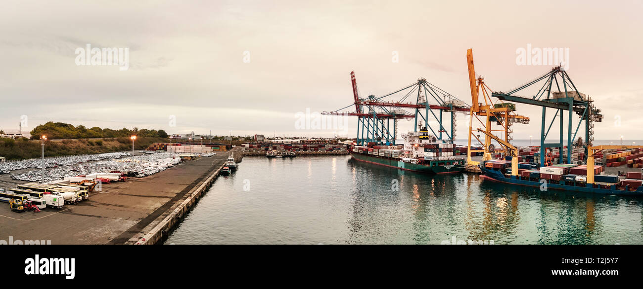 Saint Denis, Reunion Island - January 27th, 2019: Panoramic view of cranes  and cargo containers ships at the Port of Saint Denis in Reunion Island (Fr  Stock Photo - Alamy
