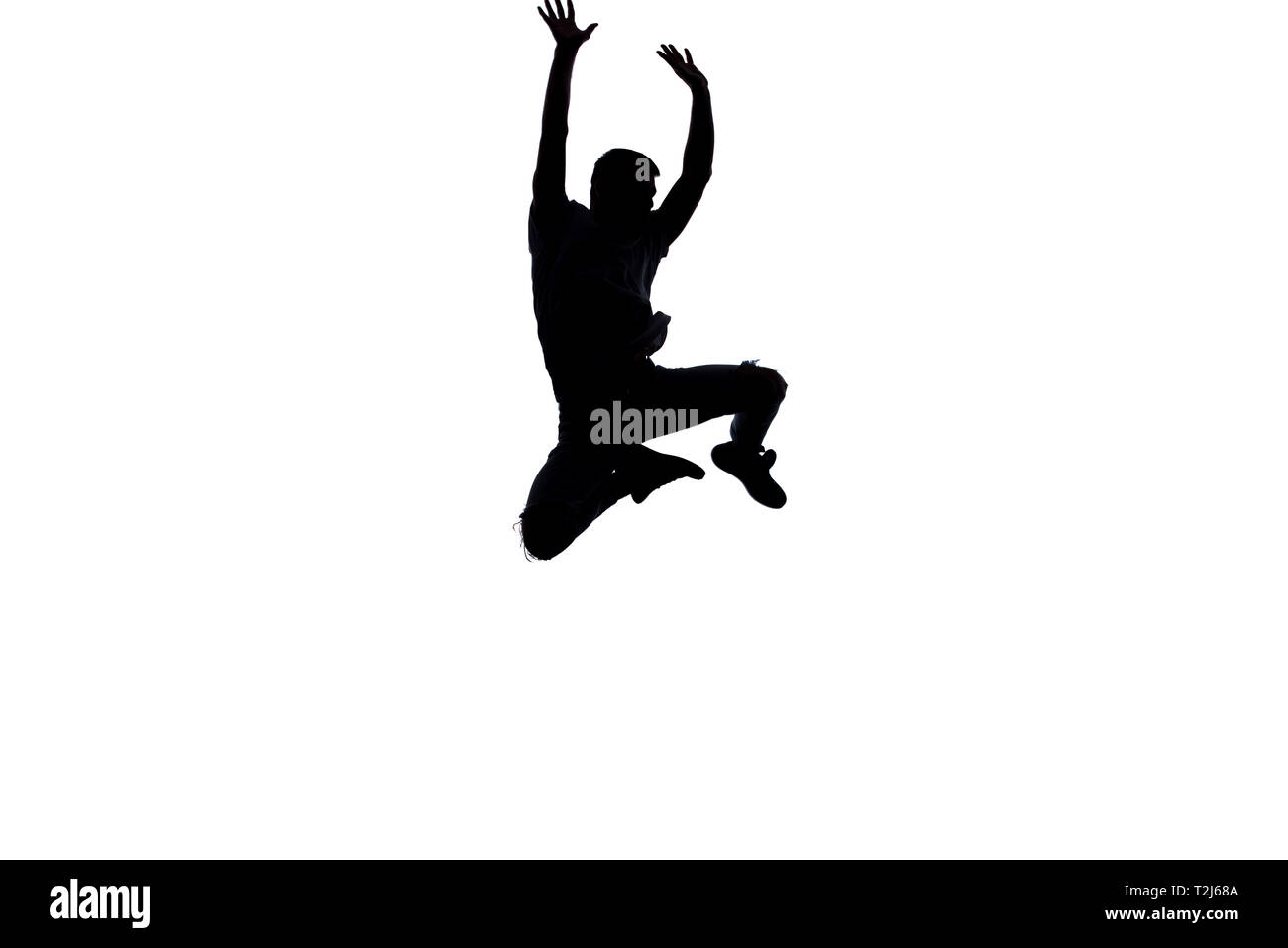 An urban guy is doing breakdance in the studio Stock Photo