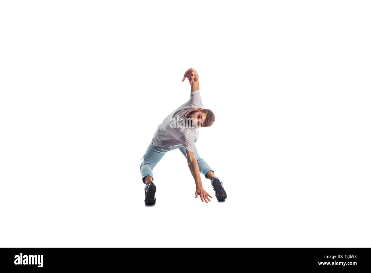 Fit man doing amazing dance exercise Stock Photo