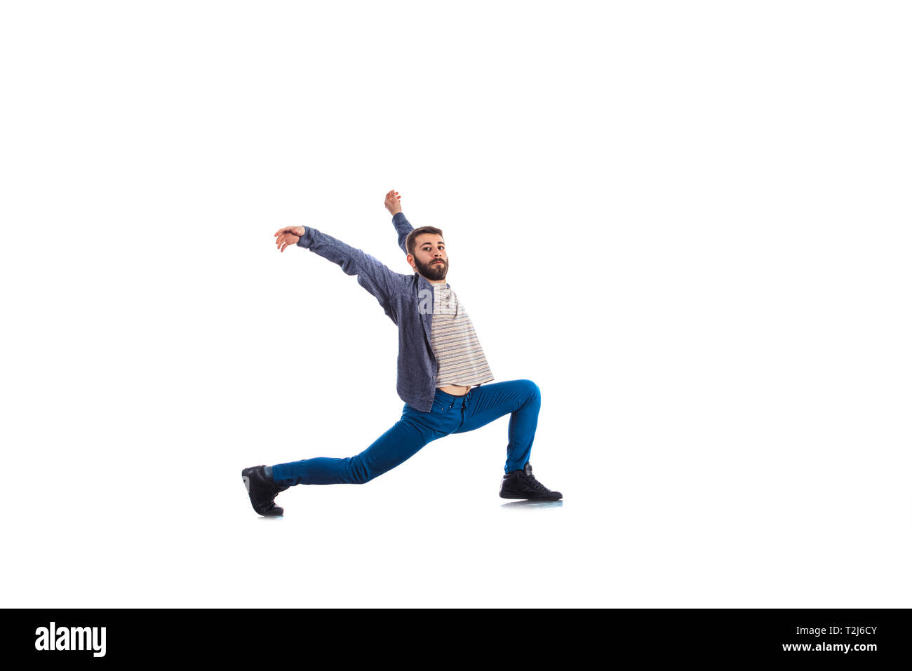An urban guy is doing breakdance in the studio Stock Photo