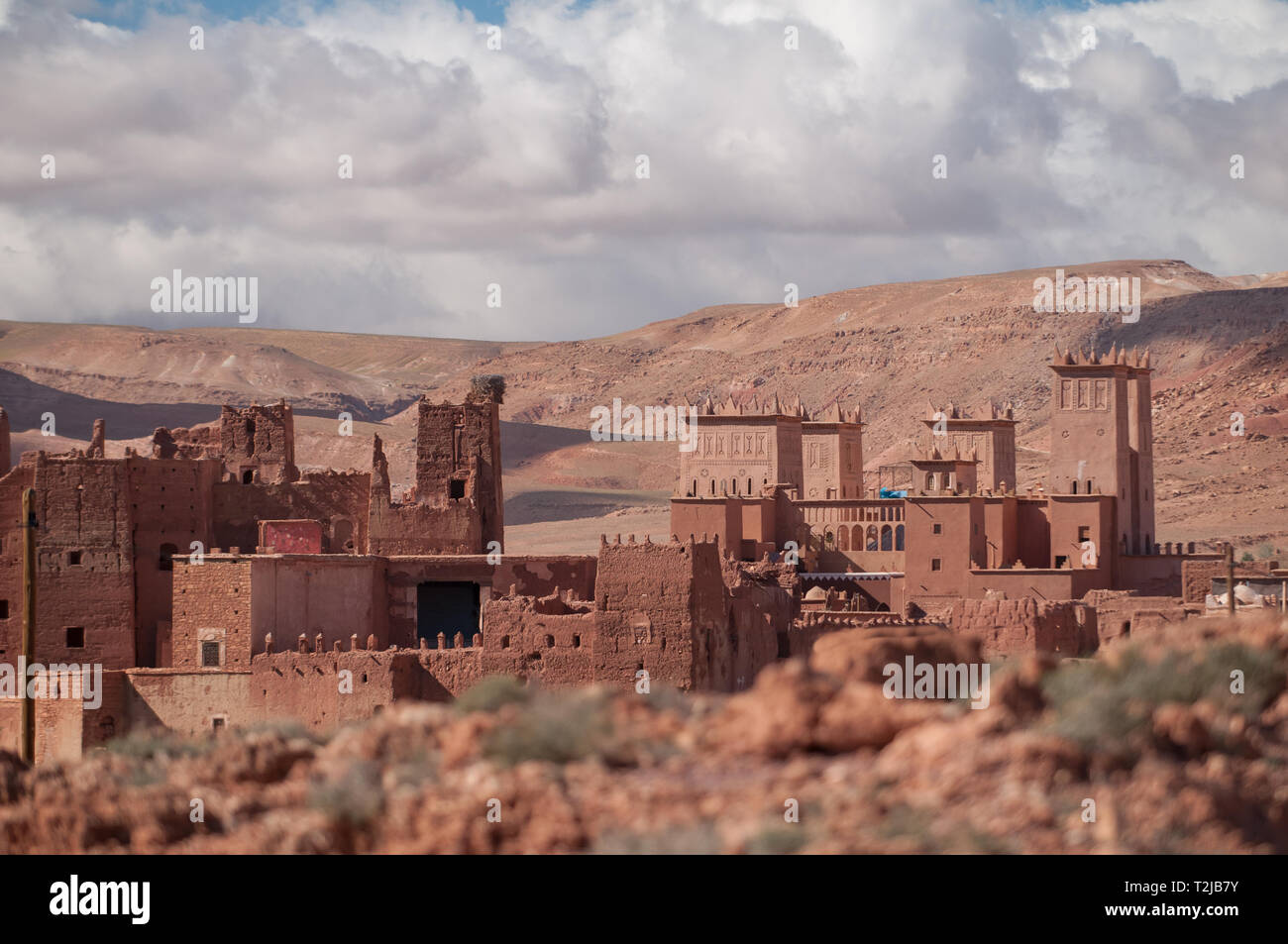 Old Kasbah village in Morocco with Atlas mountains in the background Stock Photo