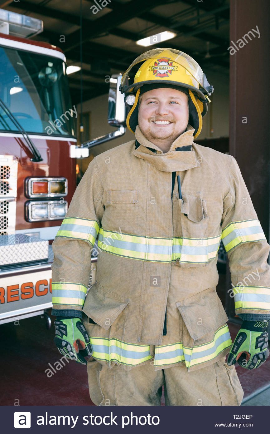 Portrait confident, smiling male firefighter Stock Photo - Alamy