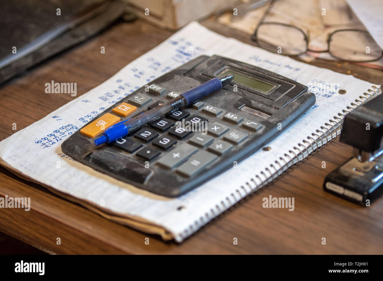 Well used calculator rests on top of lined notebook, Laytonsville Maryland Stock Photo