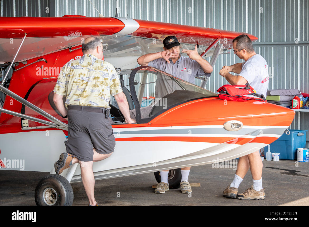 Group of men gather around Searey Elite Amphibious Light Sport airplane and discuss, Stevensville, MD Stock Photo