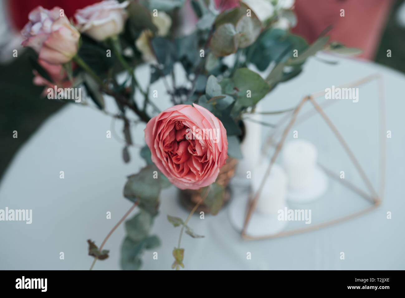 Beautiful flowers in rustic style at a wedding party. Stock Photo