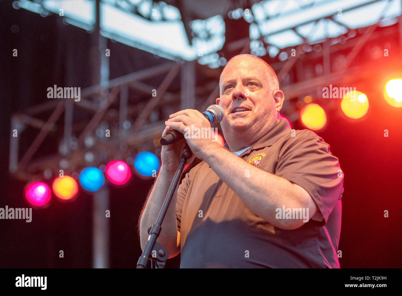 Maryland Governor Larry Hogan speaking at microphone on stage at National Folk Festival in Salisbury, MD Stock Photo