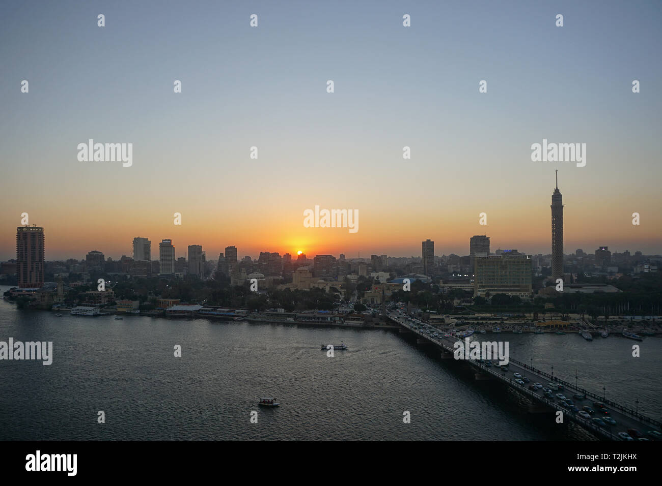 Cairo, Egypt: Cairo Tower and the Qasr el Nile Bridge at sunset. On ...