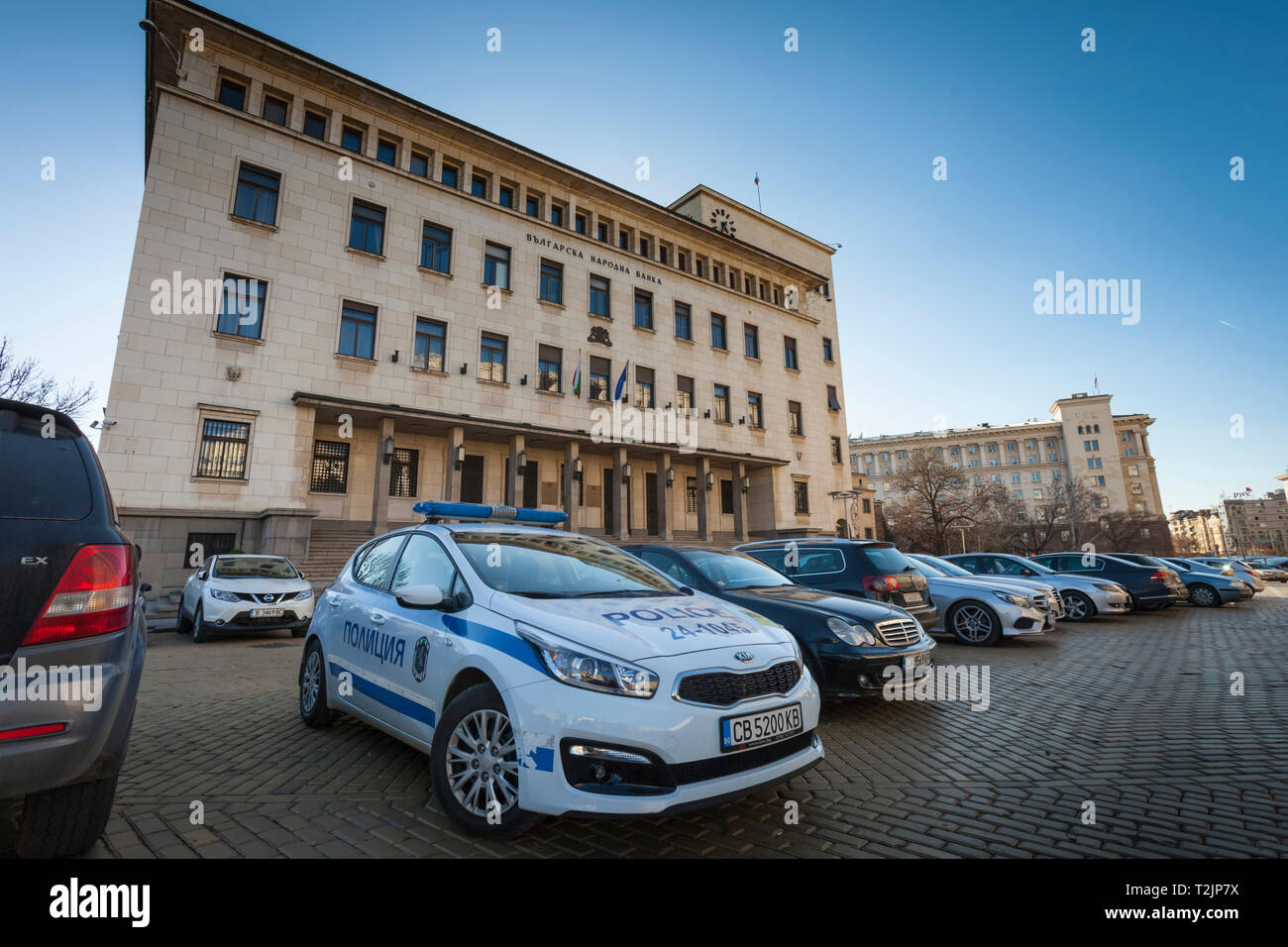 The headquarters of the Bulgarian National Bank in Sofia, Bulgaria,  with a police car in front Stock Photo