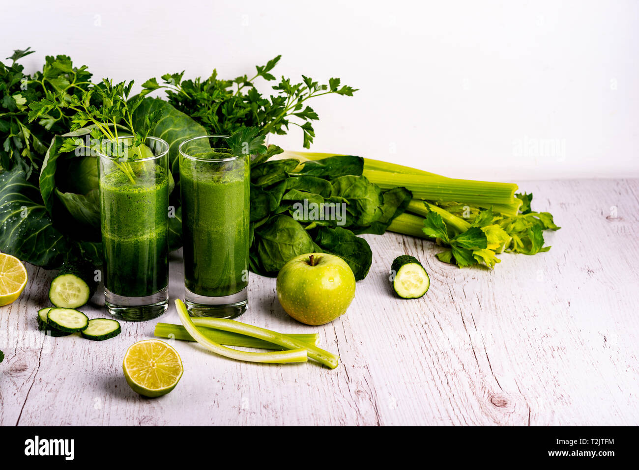 Detox health smoothie with green spinach and kale at wooden white ...