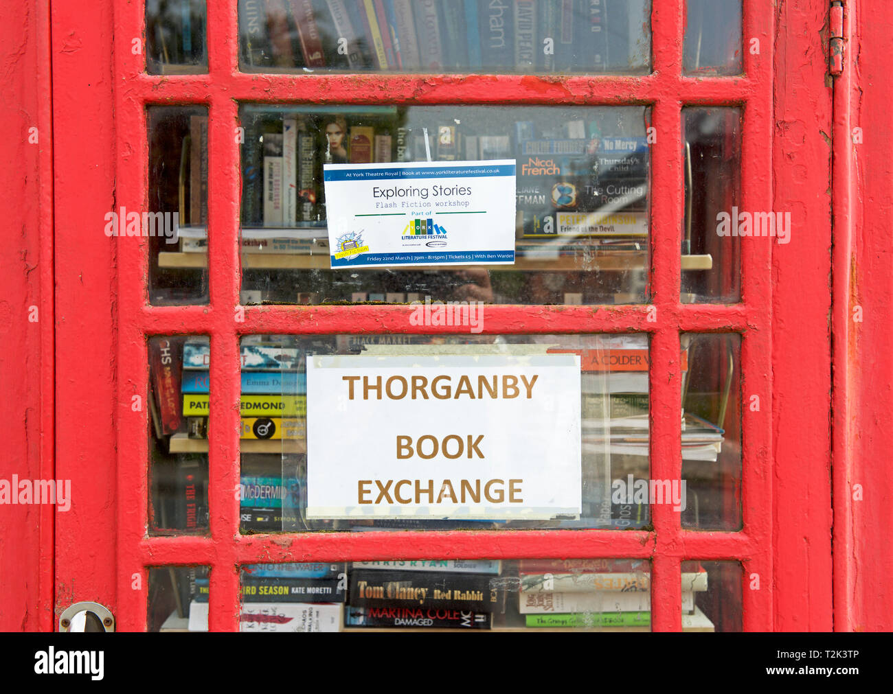 Redundant telephone box used as a lending library in the village of Thorganby, East Yorkshire, England UK Stock Photo