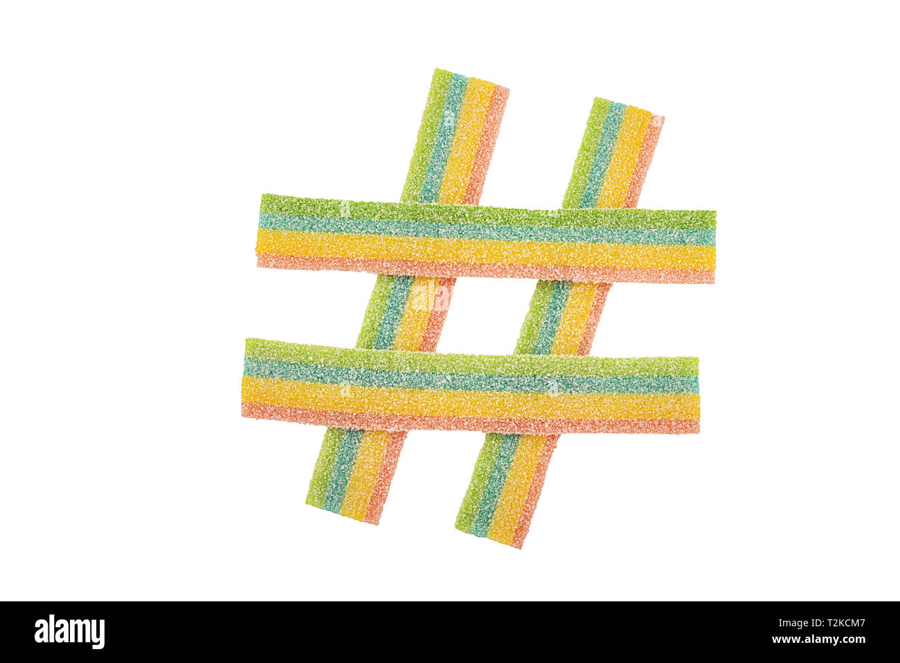 Colorful candy hashtag symbol isolated on white background. Top view. Stock Photo