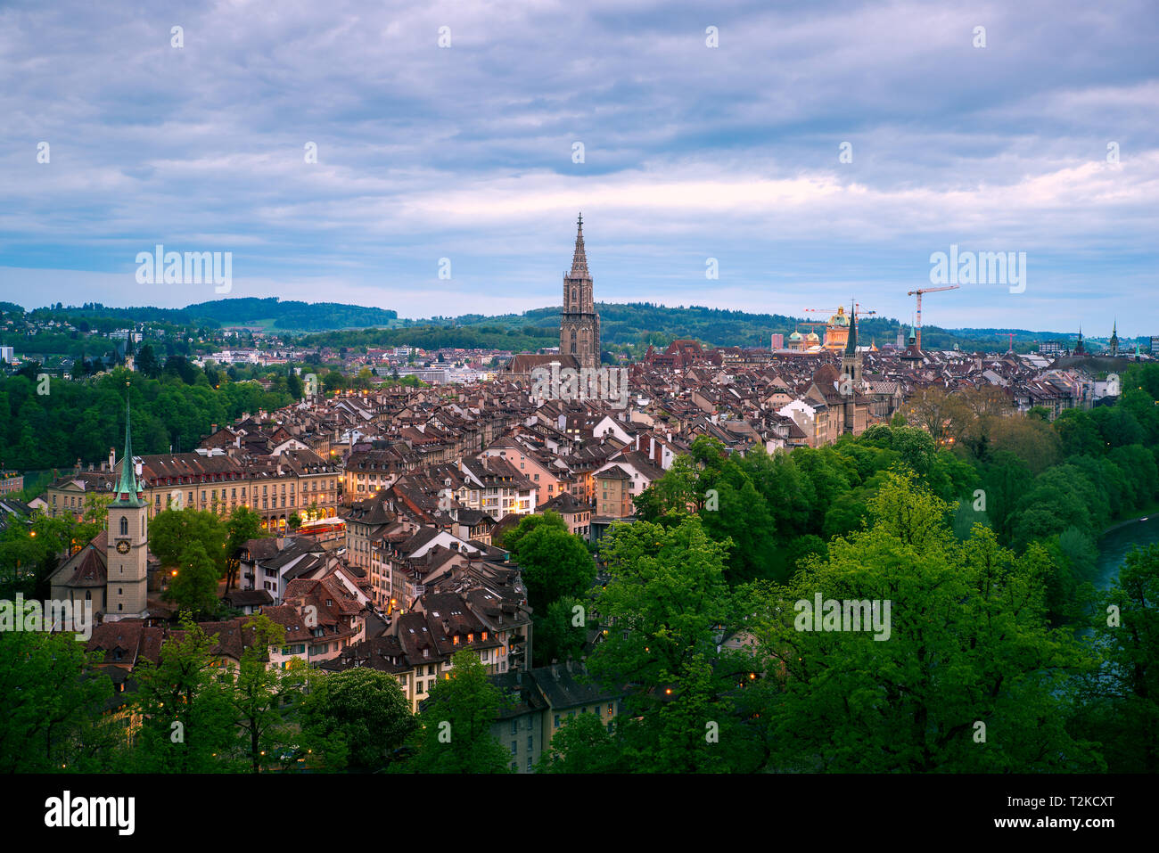 Aerial view of the Bern old town with the Aare river flowing around the town at night in Bern, Switzerland. Stock Photo