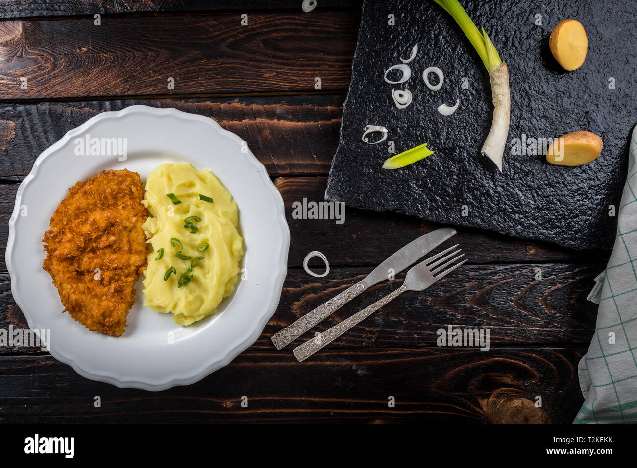 Fried chicken steak or schnitzel with mashed potatoes on wood table Stock Photo Alamy