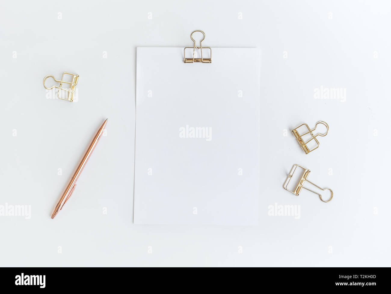 Top view of white notepaper with paperclip on worktable.minimalist style for creativity disign Stock Photo