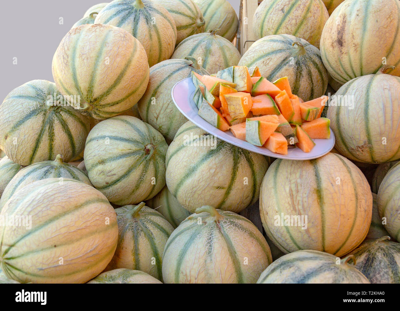 lots of honeydew melons and some taste pieces Stock Photo Alamy