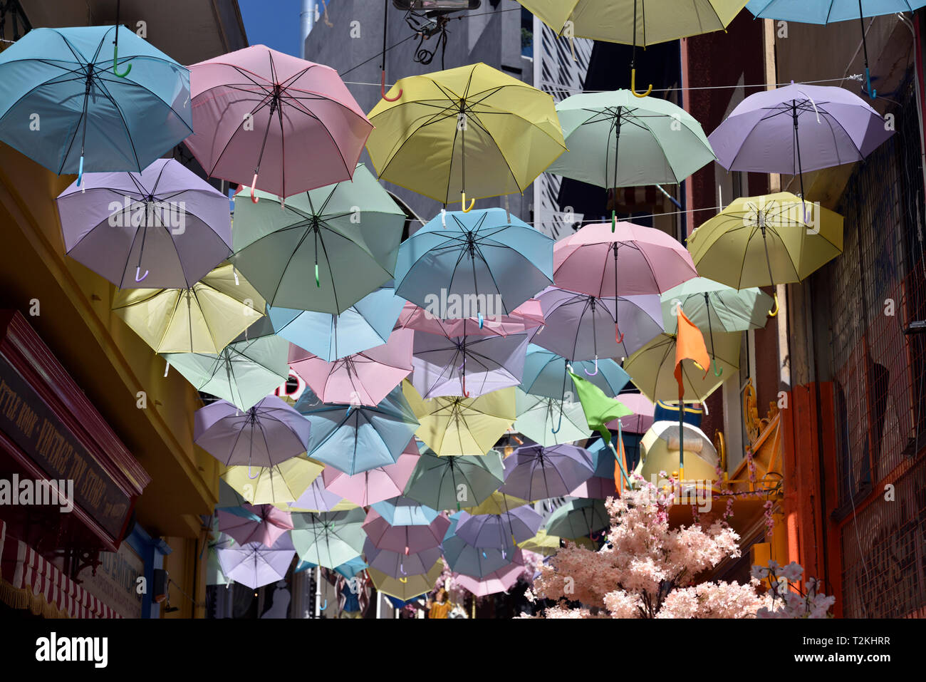 Colorful umbrellas hanging in a street in Psirri, Athens, Greece Stock