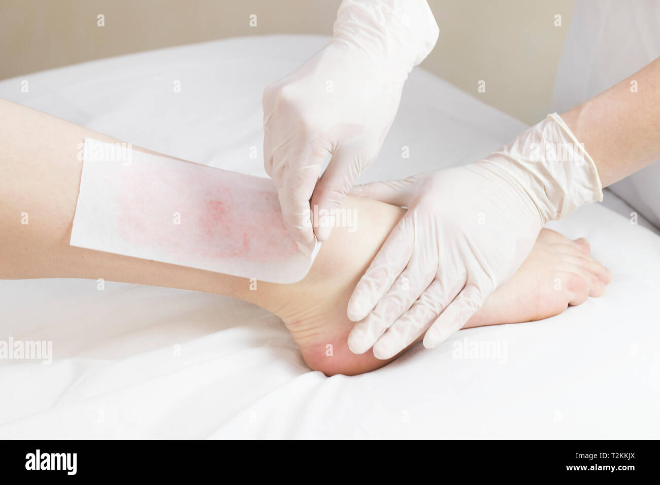 Beautiful woman doing depilation legs hi-res stock photography and ...