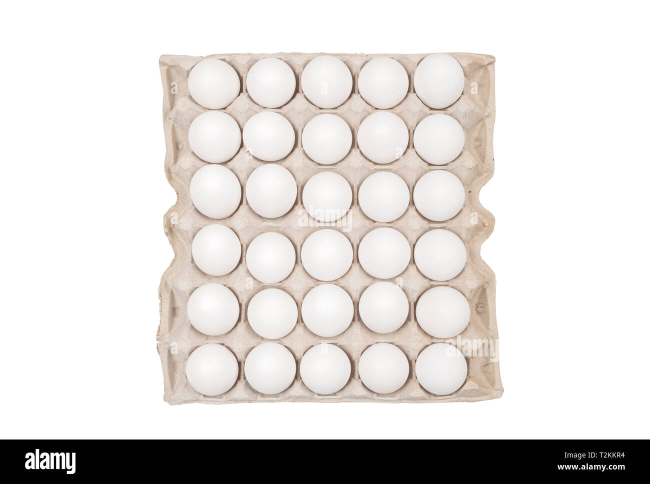 Raw chicken eggs in egg box on white background Stock Photo - Alamy