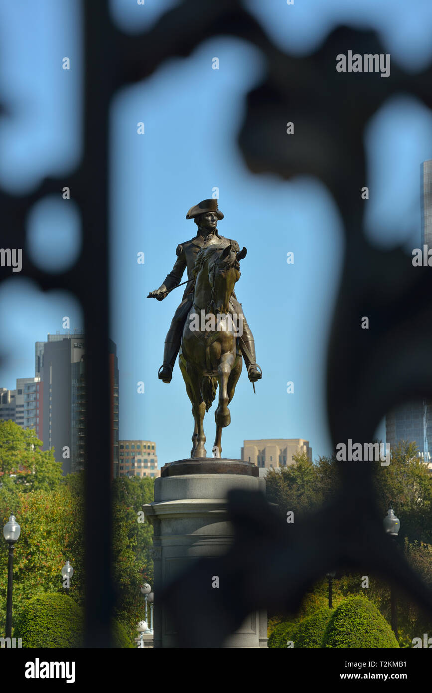 George Washington Statue in Boston Public Garden, framed by Arlington Gate Stock Photo