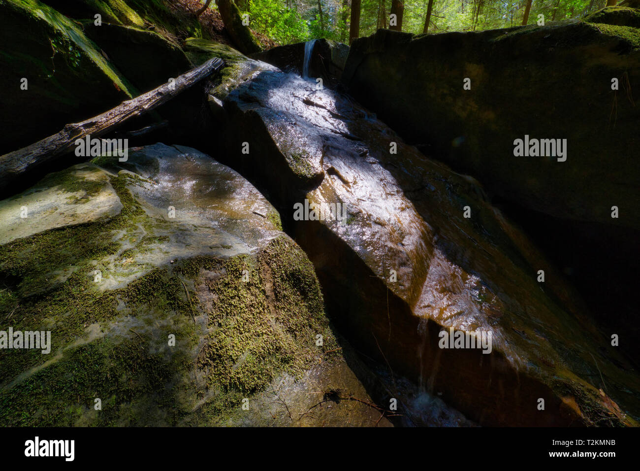 The water cascades over the boulders at the Natural Bridge in northern