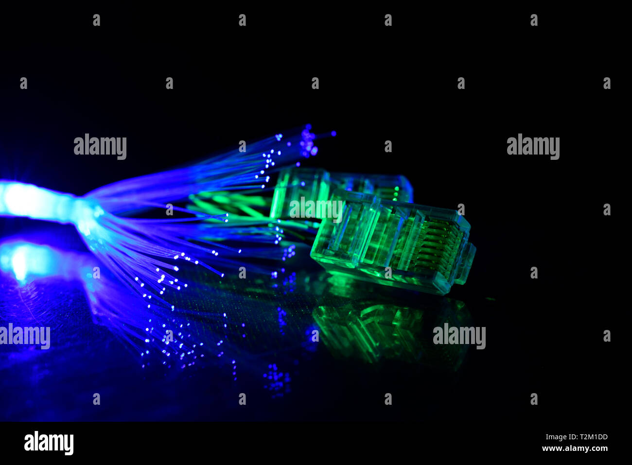Network cable with fiber optics light on black background Stock Photo ...