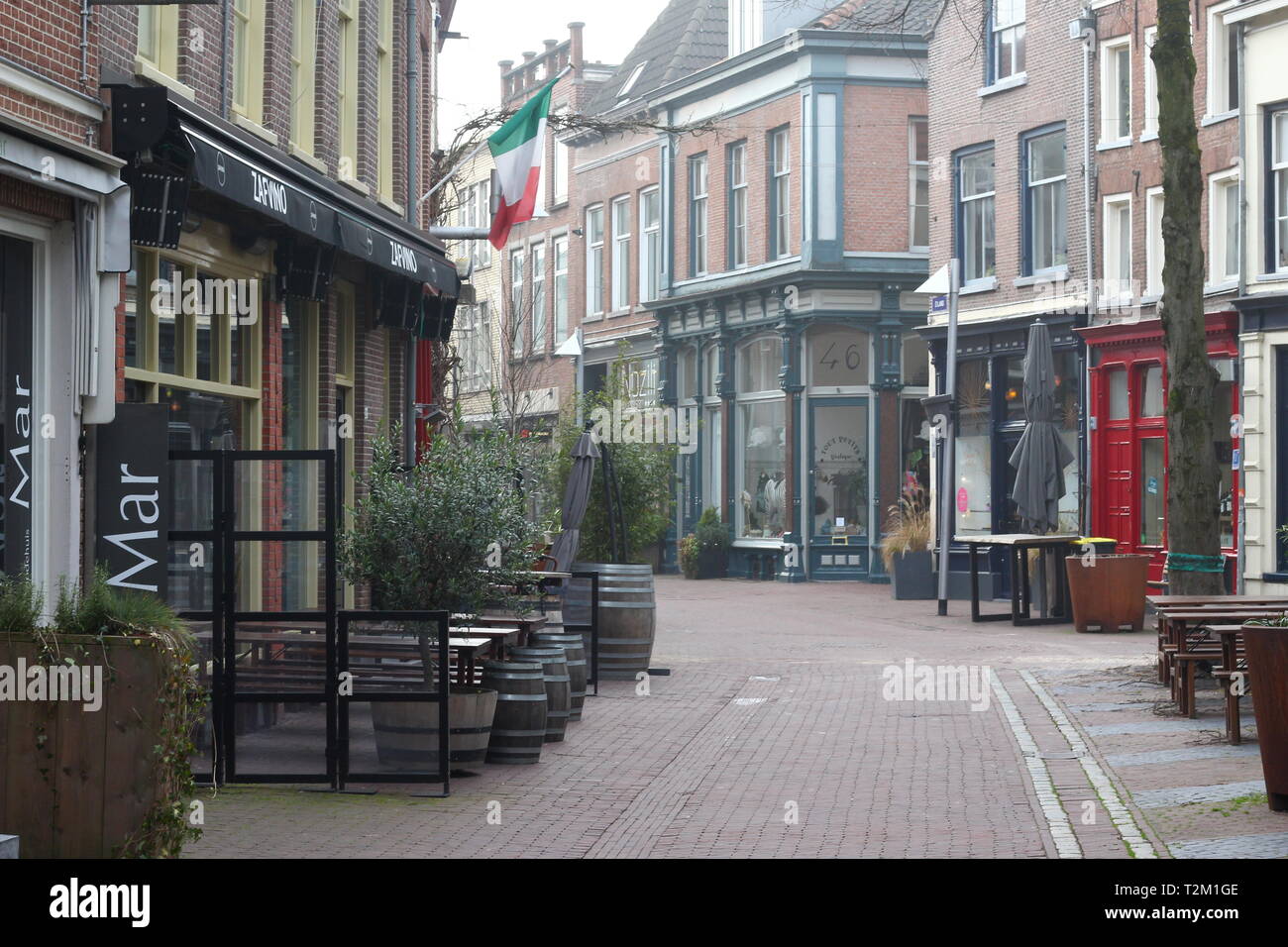 ARNHEM, NETHERLANDS - MARCH 22, 2019: Nice and picturesque ancient streets in the center of Arnhem, named Zwanenstraat and Kerkstraat Stock Photo